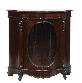 French Carved Mahogany Louis XV Style Carved Walnut Parlor Cabinet, c. 1870, the stepped bowed serpentine cookie corner top above a large bowed curved