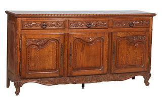 French Provincial Louis XVI Style Carved Oak Sideboard, early 20th c., the parquetry inlaid twist carved edge rectangular top over three frieze drawer