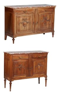 Near Pair of French Carved Walnut Louis XVI Style Marble Top Sideboards, 20th c., the rectangular highly figured pink and creme marble over two frieze
