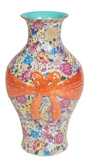 Chinese Yellow Ground Famille Rose Porcelain Baluster Vase, 20th c., with bright floral decoration and a relief orange bow and ribbon, the underside w