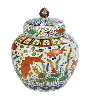 Large Chinese Wucai Porcelain Covered Baluster Jar, 20th c., with brightly colored fish and undersea life decoration, the lid with a swirled colorful 