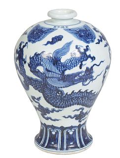 Large Chinese Blue and White Baluster Porcelain Vase, 20th c., with an everted rim, the sides with blue and white dragons and clouds on a flared circu