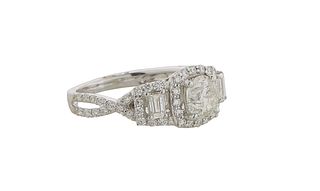 Lady's 18K White Gold Dinner Ring, with a central .96 ct. round diamond atop a border of tiny round diamonds, with baguette and round diamond lugs and