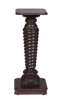 American Carved Mahogany Pedestal, early 20th c., the ogee edge octagonal top on a large tapered ring turned support, to a curved base, on a stepped o