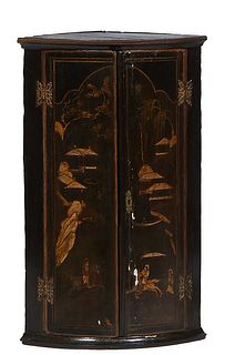 Chinoiserie Black Lacquer Hanging Corner Cabinet, 19th c., the double curved doors with gilt figural and landscape decoration, with brass butterfly hi