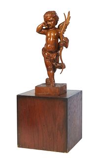 Continental School, "Weeping Cupid," carved wood statue, 20th c., mounted on a carved wooden box, Statue- H.- 19 1/2 in., W.- 7 1/2 in., D.- 5 3/4 in.