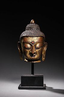 Ming: A Gilt Bronze Buddha Head
