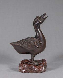 A duck shaped copper incense burner
