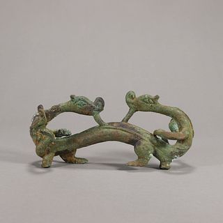 A dragon shaped bronze brush stand