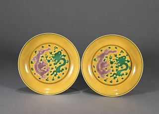 A pair of yellow ground red and green dragon porcelain plates