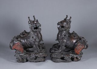 A pair of copper qilin incense burners