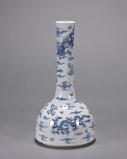 A blue and white cloud and dragon porcelain bell shaped zun