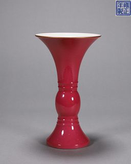 A red  porcelain beaker vase