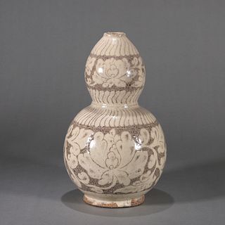 A flower carved white glazed porcelain gourd shaped vase
