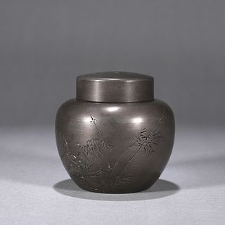 An inscribed bamboo patterned tin jar