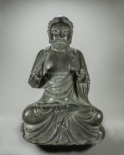A copper Bodhidharma buddha statue