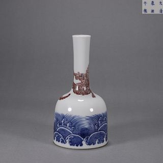 A blue and white iron red dragon porcelain bell shaped zun