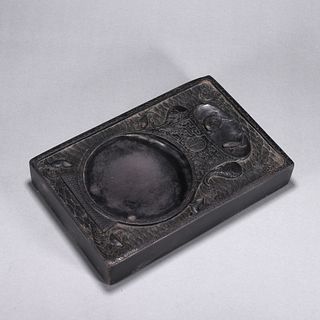 A fish and elephant patterned inkstone