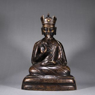 A copper silver and gold-inlaid Tibetan Karmapa statue