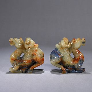 A pair of jade figure riding on camel ornaments