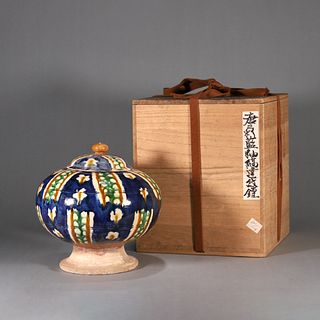 A tri-colored porcelain covered jar