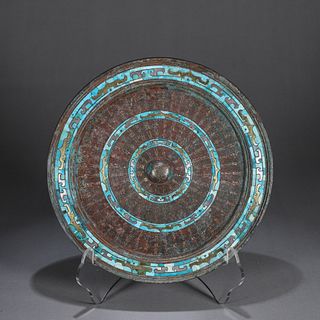 A turquoise-inlaid bronze mirror