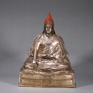 A silver Tibetan Lama statue