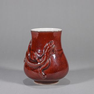 A red glazed chi dragon porcelain zun