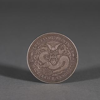 An inscribed silver coin