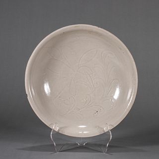 A flower carved Ding kiln white glazed porcelain plate