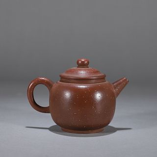 A round purple clay pot
