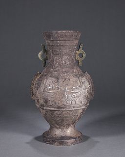 A taotie patterned silver vase