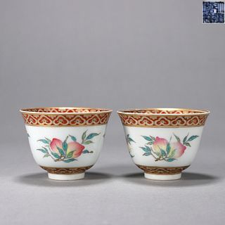 A pair of famille rose peach porcelain cups