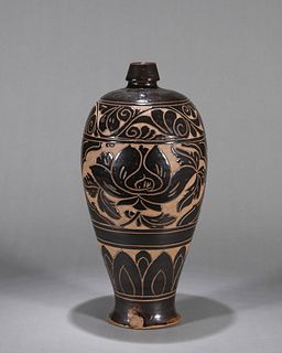 A flower carved Cizhou kiln black glazed porcelain meiping