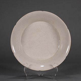 A lotus carved Ding kiln white glazed porcelain plate