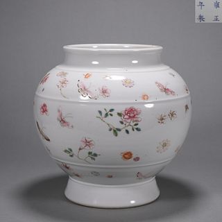 A white  famille rose flower and butterfly porcelain zun