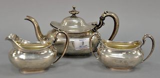 Three piece sterling tea set including tea pot, sugar, and creamer, 18.3 t oz, teapot ht. 4 1/2".