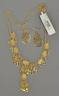 Gold necklace and pair of earrings, 10K gold filigree necklace with new tag ($879) 10.3 grams and 14K gold earrings 1.4 grams.