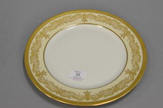 Set of twelve Limoges dinner plates with raised gold. dia. 10 3/4"