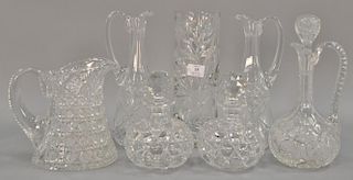 Seven cut glass bottles, vase, pitchers, and decanters, ht. 7 1/2".