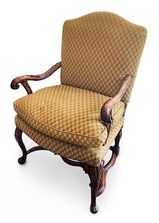 A Continental Carved Walnut Open Armchair Height 41 inches.