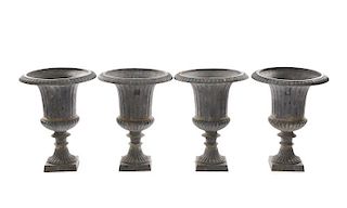 Collection of Four Weathered Cast Iron Garden Urns