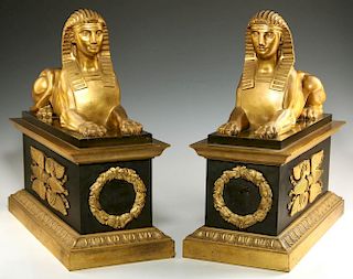 A PAIR GILT AND PATINATED BRONZE CHENETS WITH SPHINX