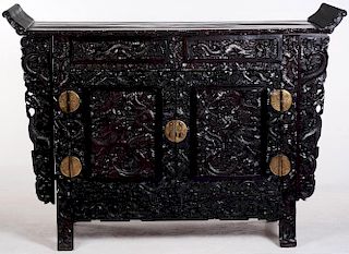 A LARGE HEAVILY CARVED CHINESE ZITAN ALTAR COFFER