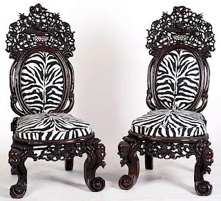 AN EXTRAORDINARY PAIR OF ANGLO CHINESE CARVED CHAIRS