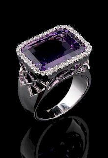 A CONTEMPORARY 14K AMETHYST AND DIAMOND FASHION RING