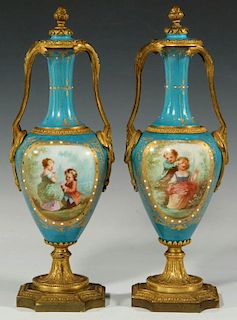 A PAIR 19C SEVRES-TYPE ORMOLU-MOUNTED PORCELAIN URNS