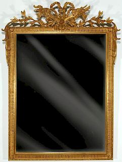 A NEOCLASSICAL STYLE CARVER'S GUILD GILT WOOD MIRROR