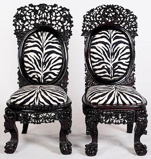 AN ASSEMBLED PAIR OF CHINESE HIGHLY CARVED CHAIRS