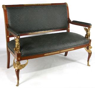 AN EMPIRE STYLE GILT BRONZE MOUNTED MAHOGANY SETTEE